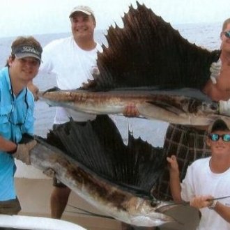 a man holding a fish