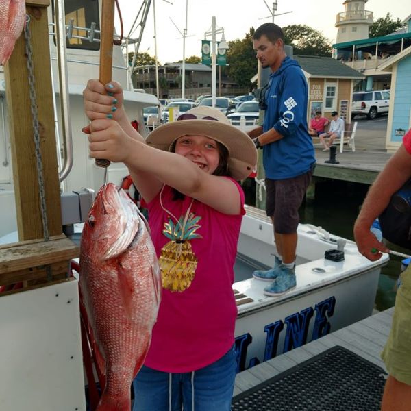 a person holding a fish