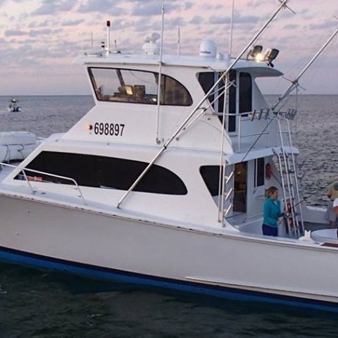 a small boat in a large body of water