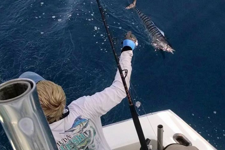 a man holding a cup of water