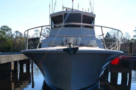 a boat is docked next to a body of water